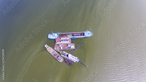 Aerial view of dredging vessels and a floating platform working in Lagos Lagoon in Oworonshoki, Lagos, Nigeria.