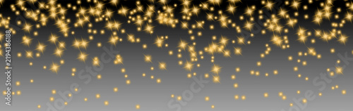 Glowing golden star sparkles scattered over a dark to gray gradient background, creating a festive luxury light effect for holiday designs