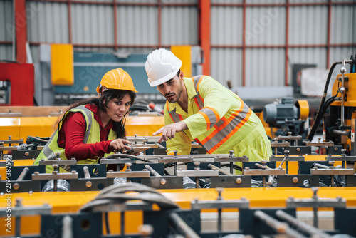 Technicians Collaborate on Steel Manufacturing Process in Industrial Factory