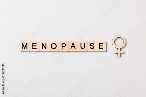 Menopause word tiles for women health concept