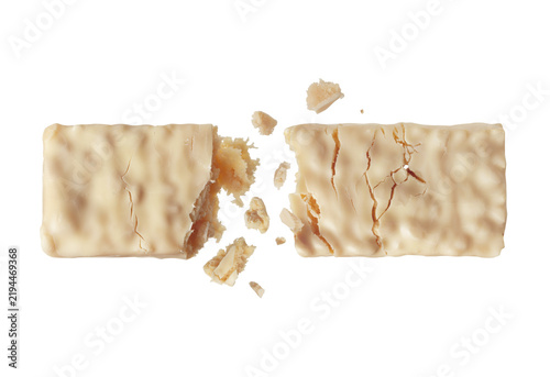 White energy bar broken into two halves in the air close-up isolated on transparent background