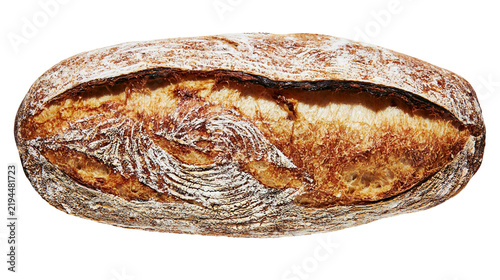 Obraz na plátne Isolated freshly baked rustic sourdough bread loaf with a prominent scoring and