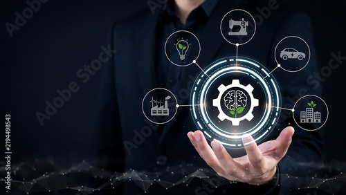 Businessman holding digital artificial intelligence gear icon with connected industry and sustainable infrastructure elements