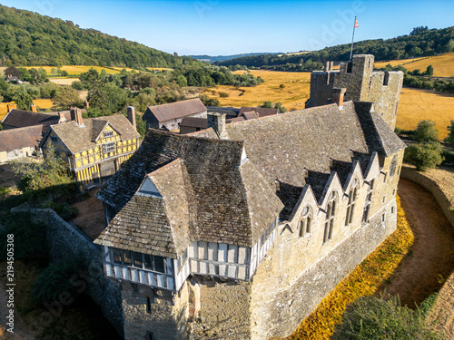 Aerial view of Stokesay Castle, a well-preserved 13th-century fortified manor house with timber-framed buildings and stone walls, set in the rural landscape of Craven Arms, England, United Kingdom.