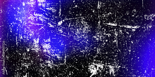 Abstract blue grunge background with white scratches and glowing light effect