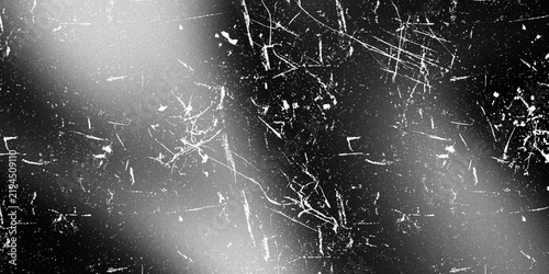 Monochrome distressed background with white scratches and light leak overlays