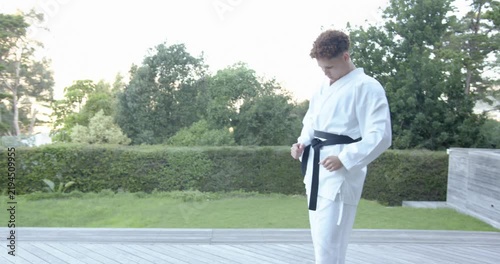 Lifestyle videos outdoor of people doing activities , practicing martial arts, person in karate unif