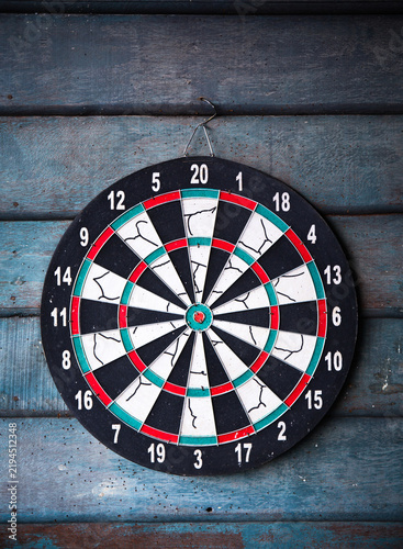 The darts isolated on wooden background