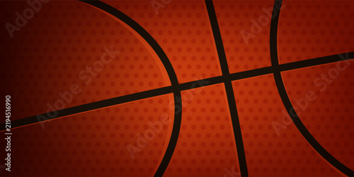 Close-up basketball texture with orange surface and black lines,