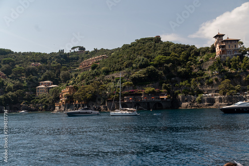 Quadro su tela Scenic coastal landscape of Portofino, Liguria, Italy, with lush green hills, Mediterranean villas and calm blue sea on a sunny summer day
