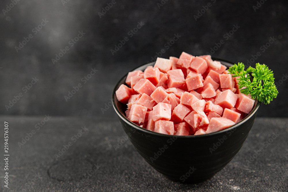 Obraz premium Ham cubed pork cold cuts pork meat delicious appetizer, gourmet dish table setting food background rustic style dish, top view, text space