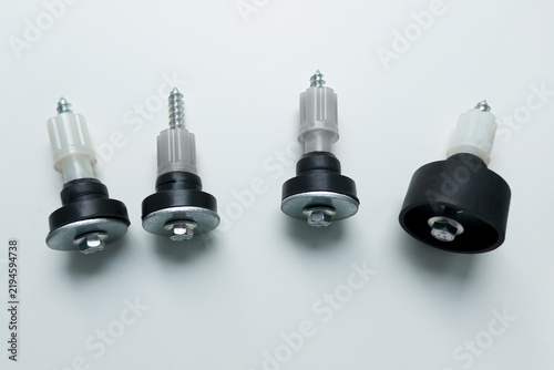 Metal transit bolts for a washing machine. White background. Top and side views.