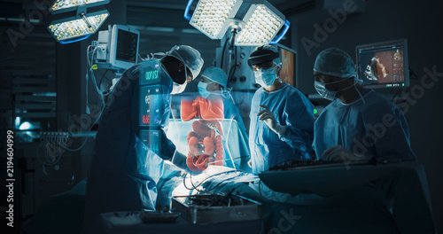 Futuristic Hospital Operating Room Surgery Using Holographic Augmented Reality. Surgical Team in an Ar Headset Views a Floating Intestine Hologram and Vital Signs While Treating the Patient's Bowel.