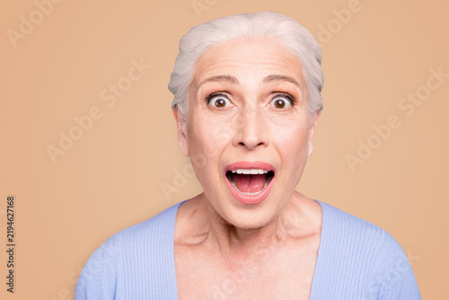 Konstfotografi Portrait of gray haired old beautiful angry shocked woman with opened mouth