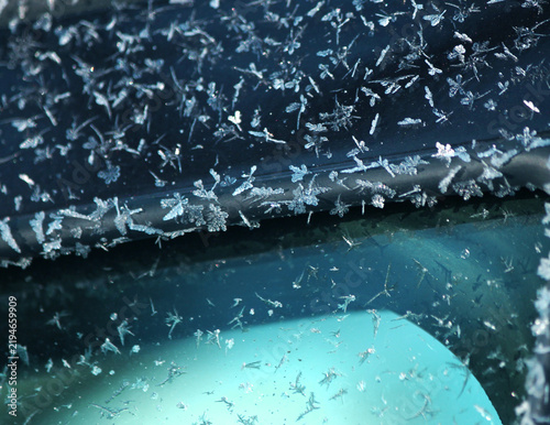 Ice butterflies on a frozen car door