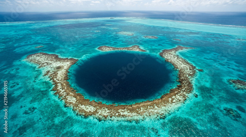 Great Blue Hole Sinkhole Surrounded By Coral Reef In Tropical Ocean