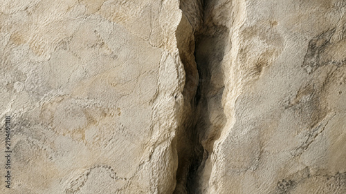 Natural limestone rock texture with deep vertical crack, weathered beige stone surface, organic geological mineral background for architectural design