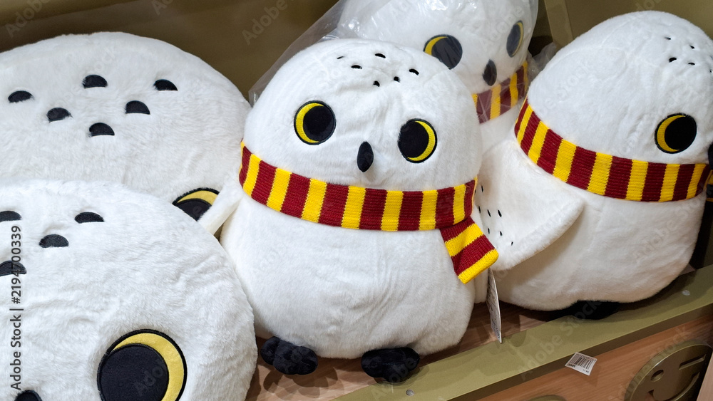 Obraz premium cute white harry potter hedwig snowy owl plush dolls and cushions wearing gryffindor scarf on September 16, 2026 in Bangkok, Thailand.