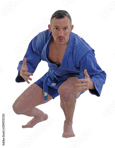 Martial arts fighter wearing blue kimono isolated on transparent layered background.