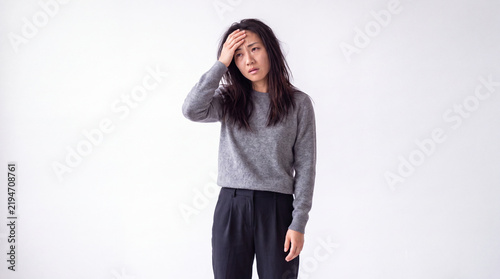 Exhausted Young Woman Experiencing Stress and Headache against White Background