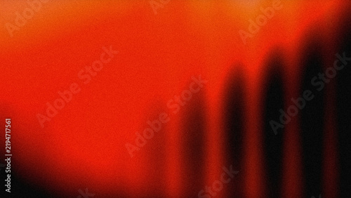 Abstract red and black gradient background with grain texture