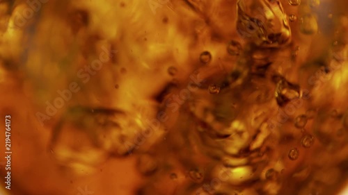 Super Slow Motion Shot of Waving Golden Liquid Background at 1000fps.
