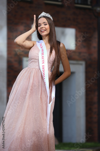 Smiling Beauty Queen With Crown and Sash Posing