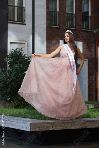 Smiling Beauty Queen With Crown and Sash Posing