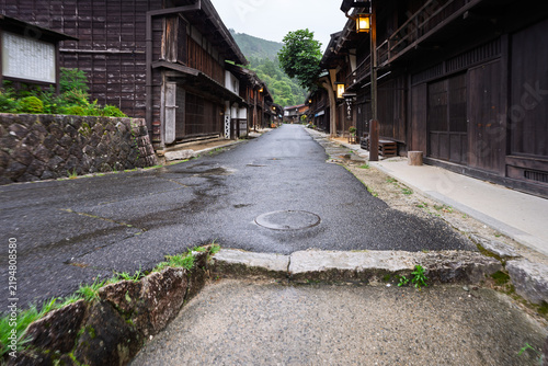 Step up to walking street in traditional Japanese village on Nakasendo - Tsumago, Juku, Nagano