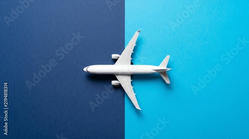 White Airplane Toy on Blue and Dark Blue Background