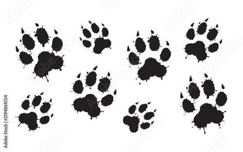 Ink splatter animal paw prints set in scattered layout for messy natural tracking themes.