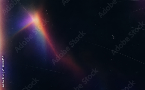 Purple Light Flare Glowing Across Dark Abstract Background