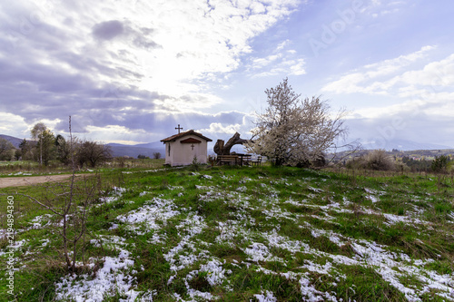 Small chapel in a rural snowy landscape, Bulgaria.