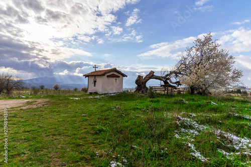 Small chapel in a rural snowy landscape, Bulgaria.