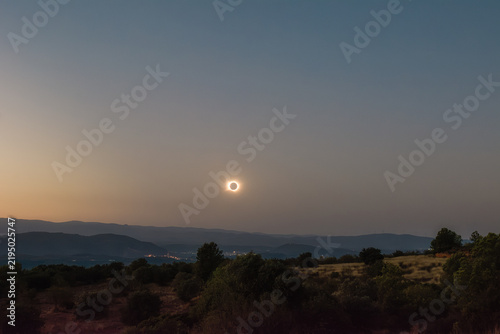 Total Solar Eclipse Ring over Twilight Landscape
