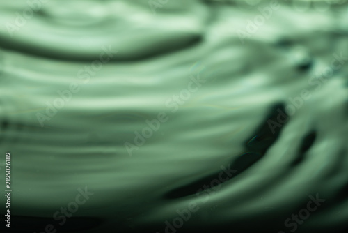 279.Green-Tinted Liquid Surface with Ripple Distortion