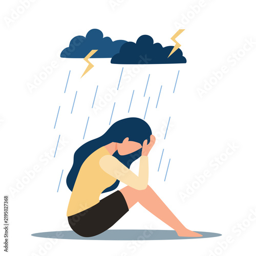 Фотография Young depressed woman sitting under metaphoric rainy cloud