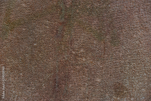 Natural brown granite stone texture with rough granular surface and weathered mineral details