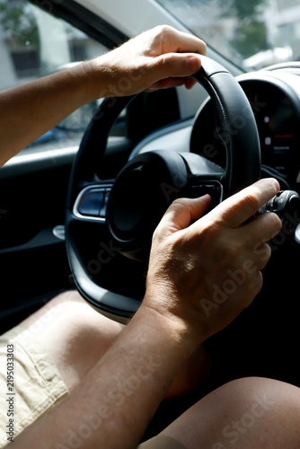 Принти на полотні Person driving car holding steering wheel hands