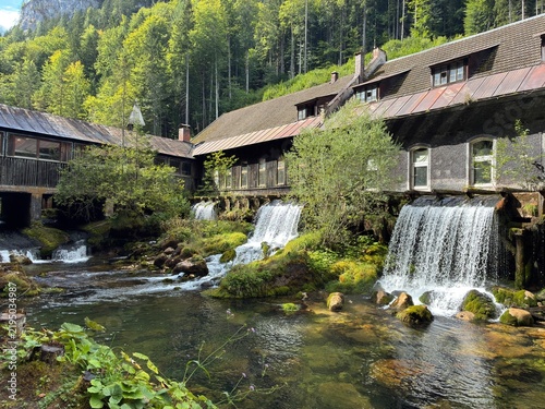 Cuadro en lienzo Historic watermill with cascading waterfalls and river in the alpine forest