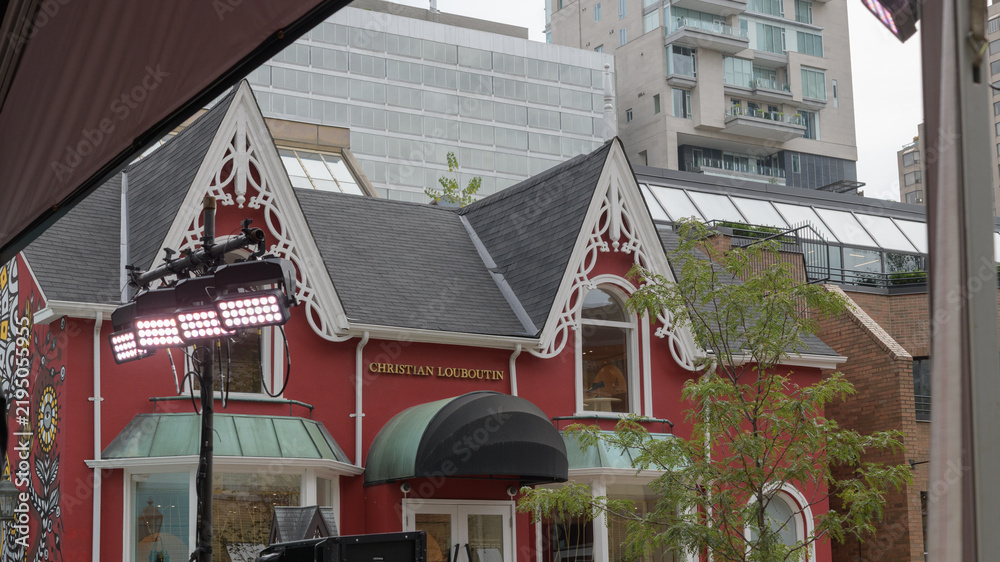 Fototapeta premium exterior building facade and sign of Christian Louboutin Yorkville, a luxury retailer of shoes, located at 99 Yorkville Av, Toronto