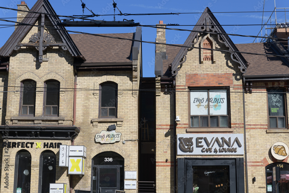 Obraz premium detail of two historic houses (now commercial properties) at 334 and 336 Dundas St W, Toronto