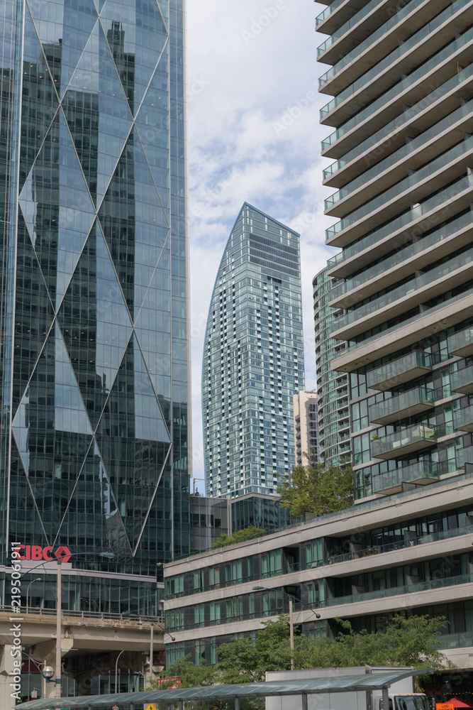 Fototapeta premium contextual view of (at center) L-Tower, a condominium complex, designed by Daniel Libeskind, with Page + Steele / IBI Group, in contemporary deconstructivist style, located at 8 The Esplanade, Toronto