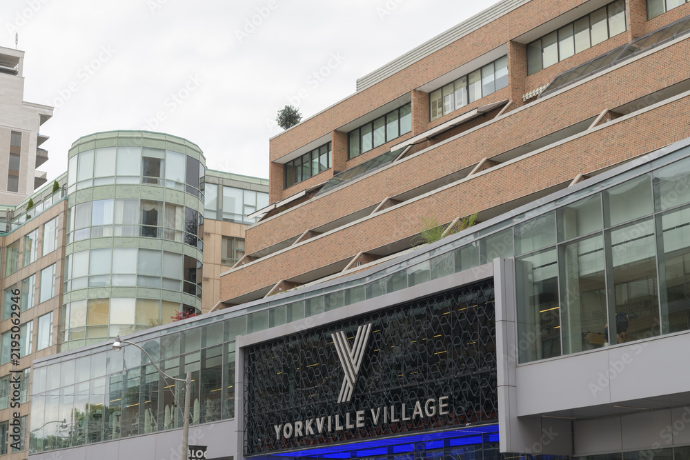 Fototapeta premium exterior building facade and sign of Yorkville Village, an upscale shopping centre in Toronto’s Bloor–Yorkville neighbourhood, located at 55 Avenue Rd