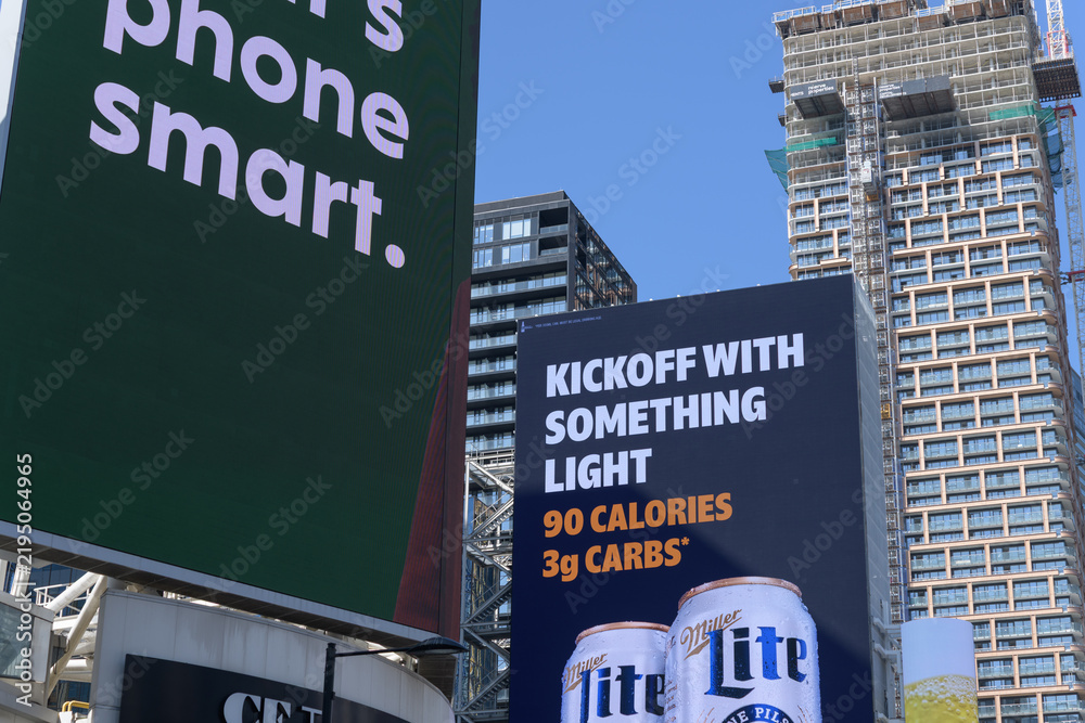 Obraz premium large-format spectacular with advertising for alcohol (Miller Lite) facing Sankofa Square, Toronto