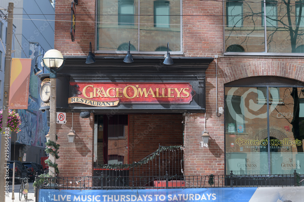 Obraz premium ghost sign of Grace O’Malley’s at 14 Duncan St, Toronto