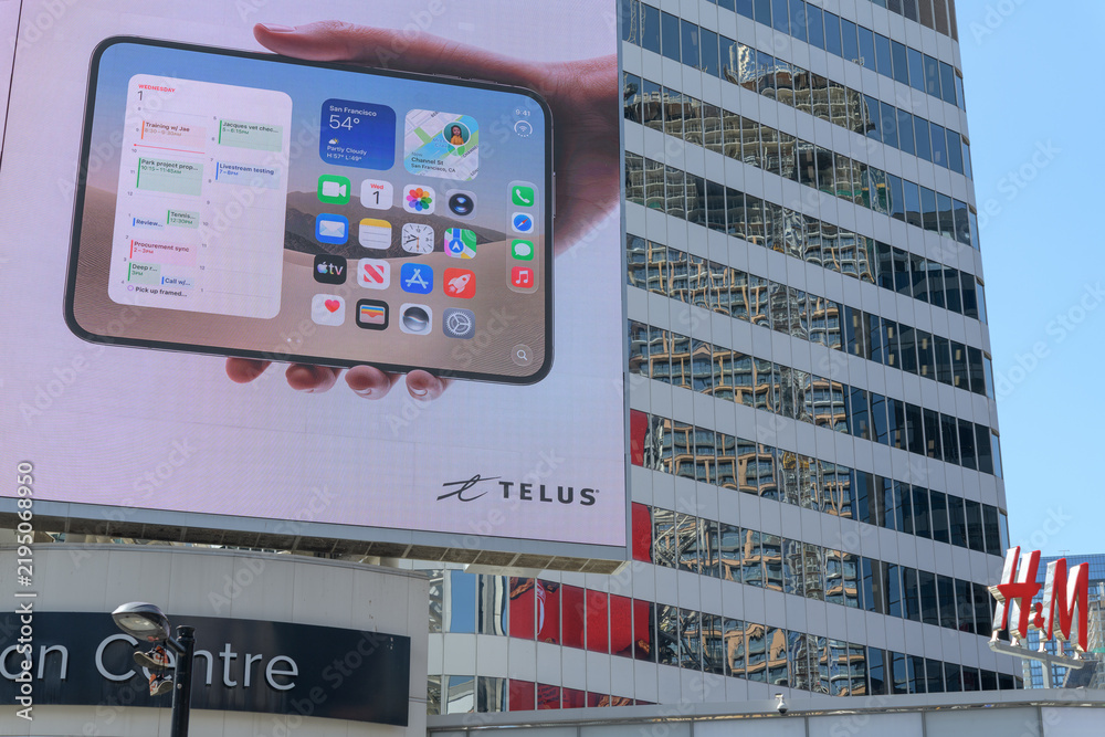 Obraz premium large-format rooftop digital spectacular with advertising by Apple Inc for the upcoming release of the iPhone Duo at Toronto's Sankofa Square
