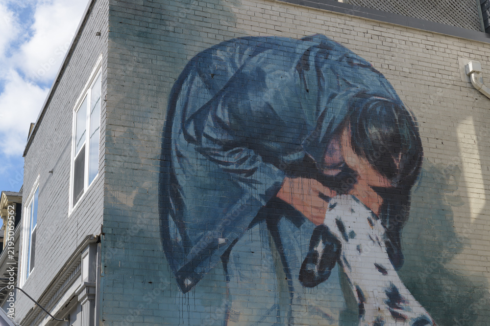 Obraz premium mural or a woman and dog by Emmanuel Jarus (aka Young Jarus) on the east-facing wall of 204 Carlton St, Cabbagetown BIA, Toronto