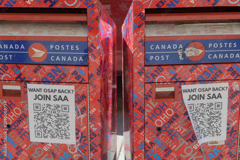 Obraz premium Canada Post street-side collection boxes with posters in Toronto