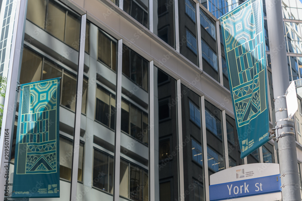 Obraz premium pole-mounted banners with geometric patterns in the Toronto Financial District BIA at York St